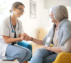 Doctor treating elderly patient