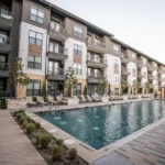 Pool with landscaping at a commercial property.