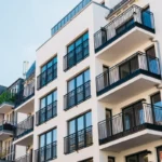 Exterior view of an apartment complex with balconies.