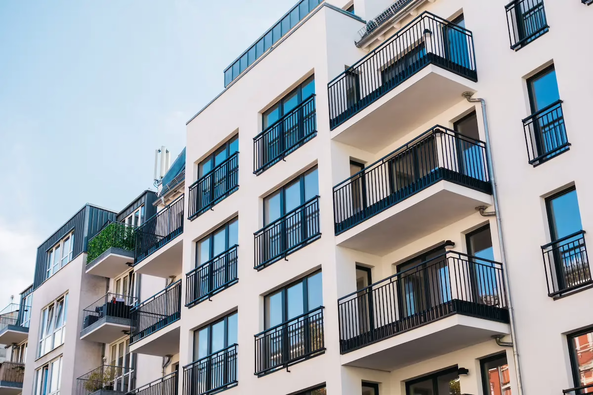 Exterior view of an apartment complex with balconies.