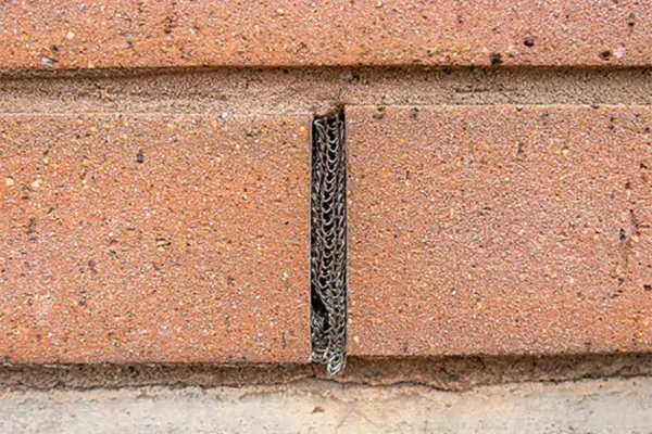 Flexi Armour Weep Hole Cover sealing up a brick weep hole with a steel mesh