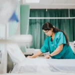 A nurse makes up a pest-free hospital bed