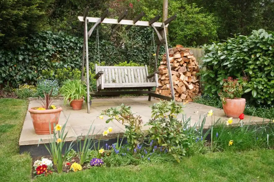 A swinging bench in the yard of a termite-free home. Find out how you can prevent lawn and garden termites from your North Carolina property.